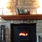 Stone fireplace with wood burning stove insert